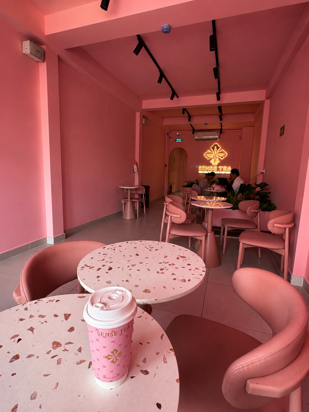 Tonal Pink Seating & Branded Table Moment - Sense Tea Saigon