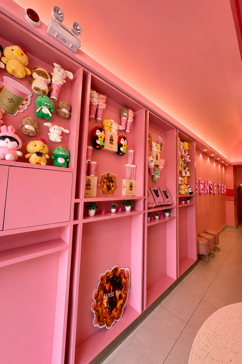 Floor-to-Ceiling Branded Display Wall - Sense Tea Saigon
