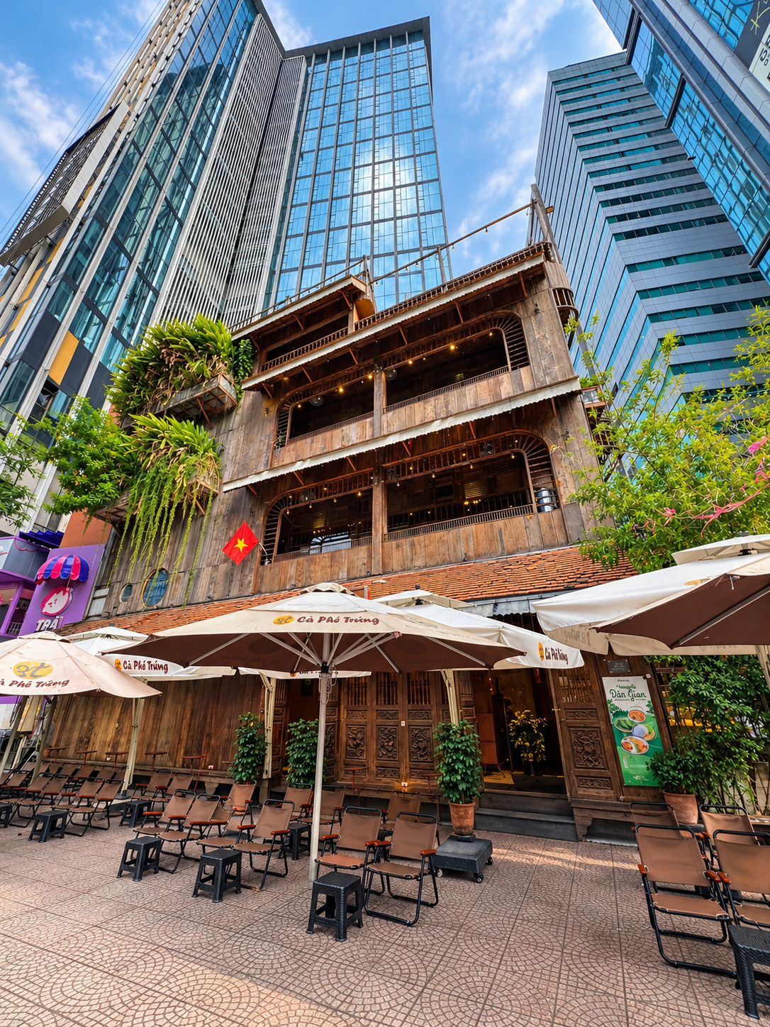 Traditional Vietnamese Wooden Egg Coffee House Surrounded by Modern High-Rises - Cà Phê Trứng 3T Saigon